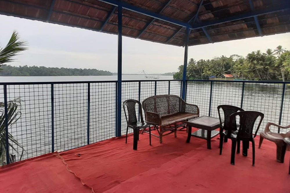 Covered seating area facing the water at Aamees Paradise