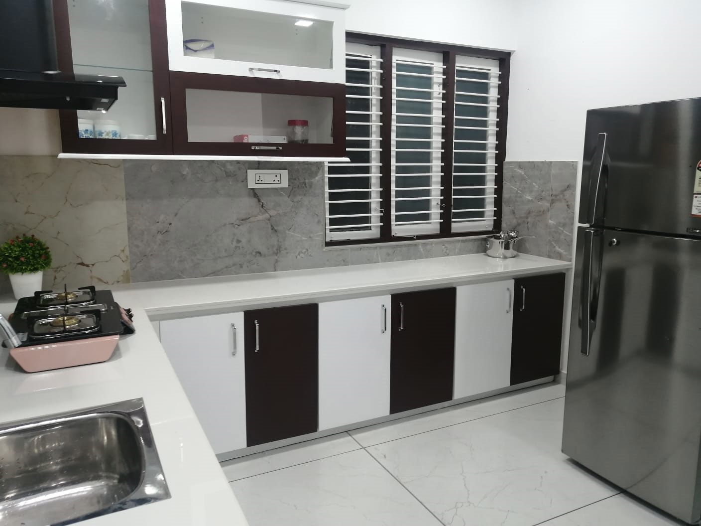 Kitchen counter and cooking space at Aamees Paradise