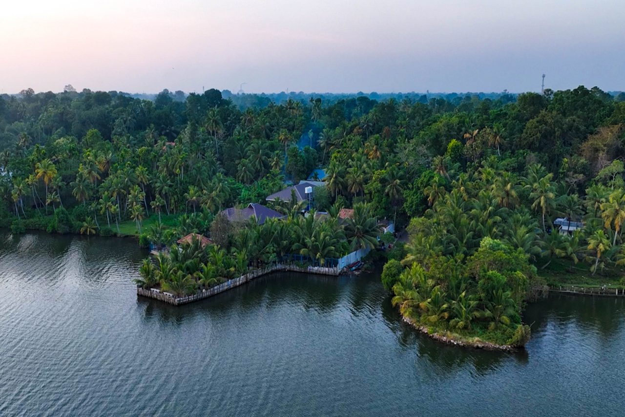 Wide aerial view of Aamees Paradise surrounded by water